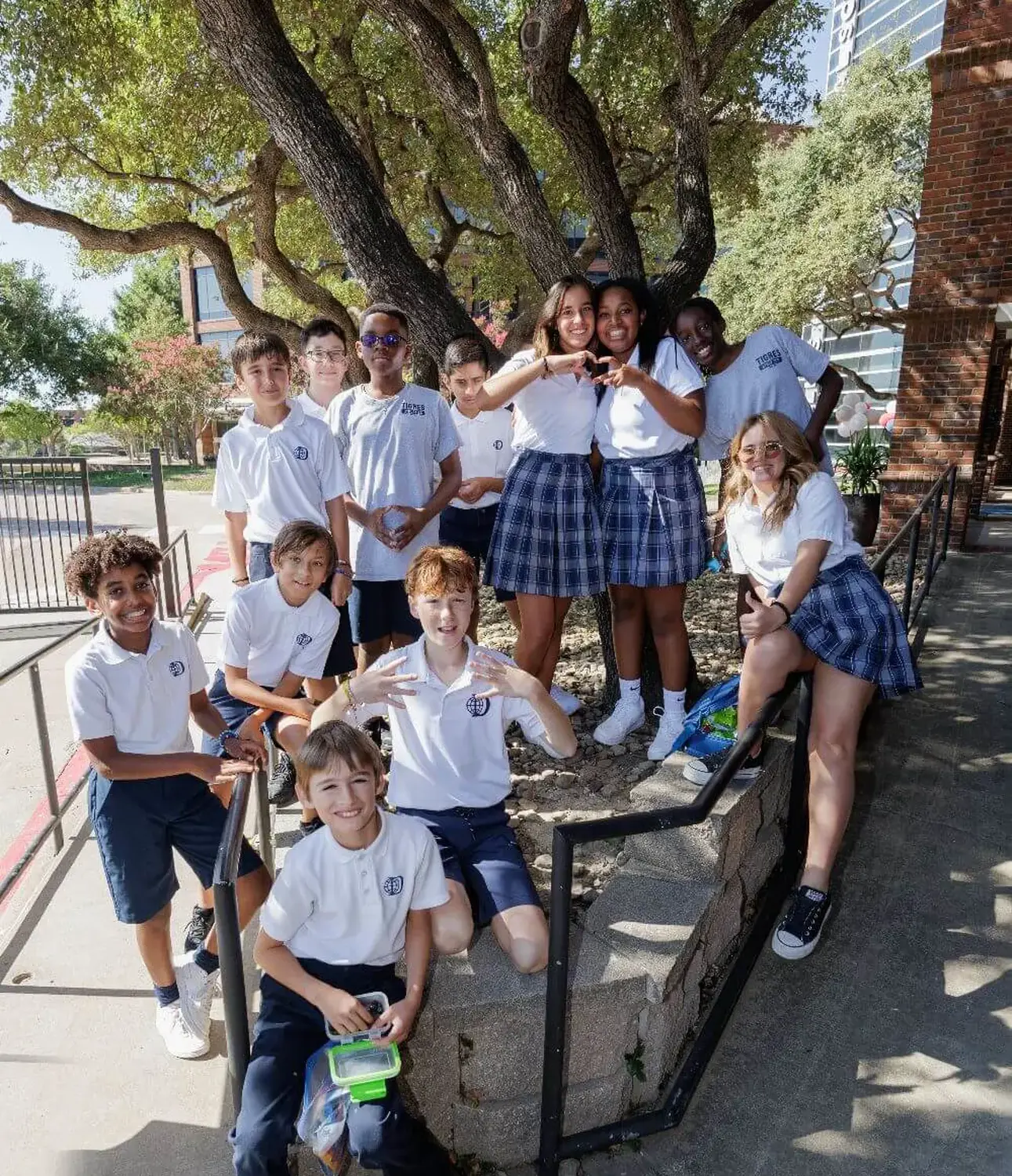 Group of DIS students posing for a photograph together on campus.
