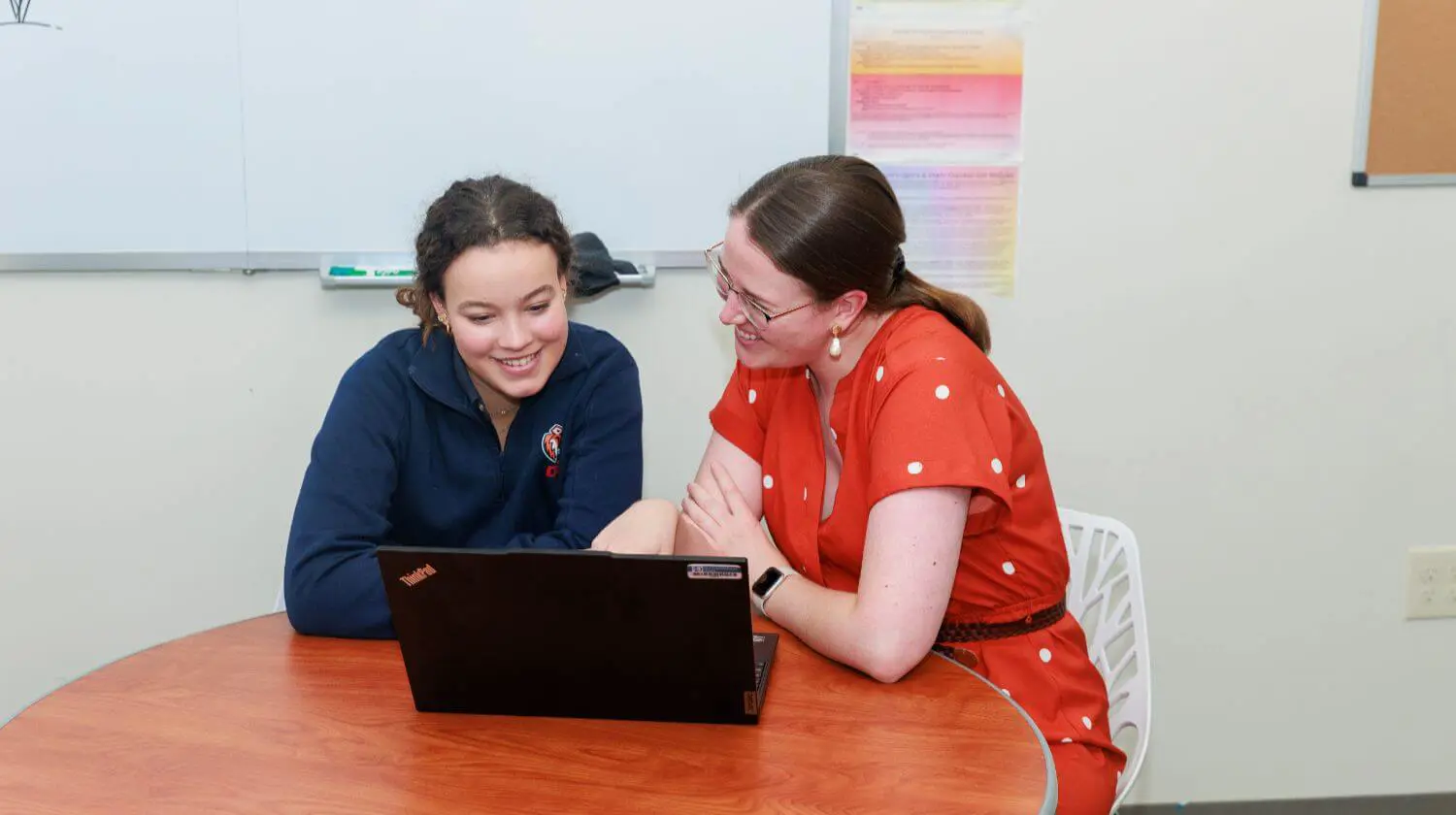 DIS HS student and teacher in a college counseling meeting.