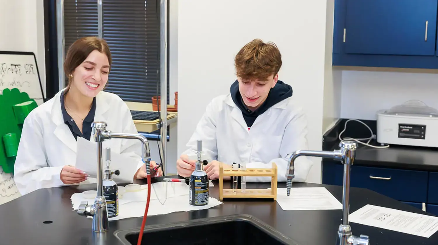 DIS high school students working together in a science class.