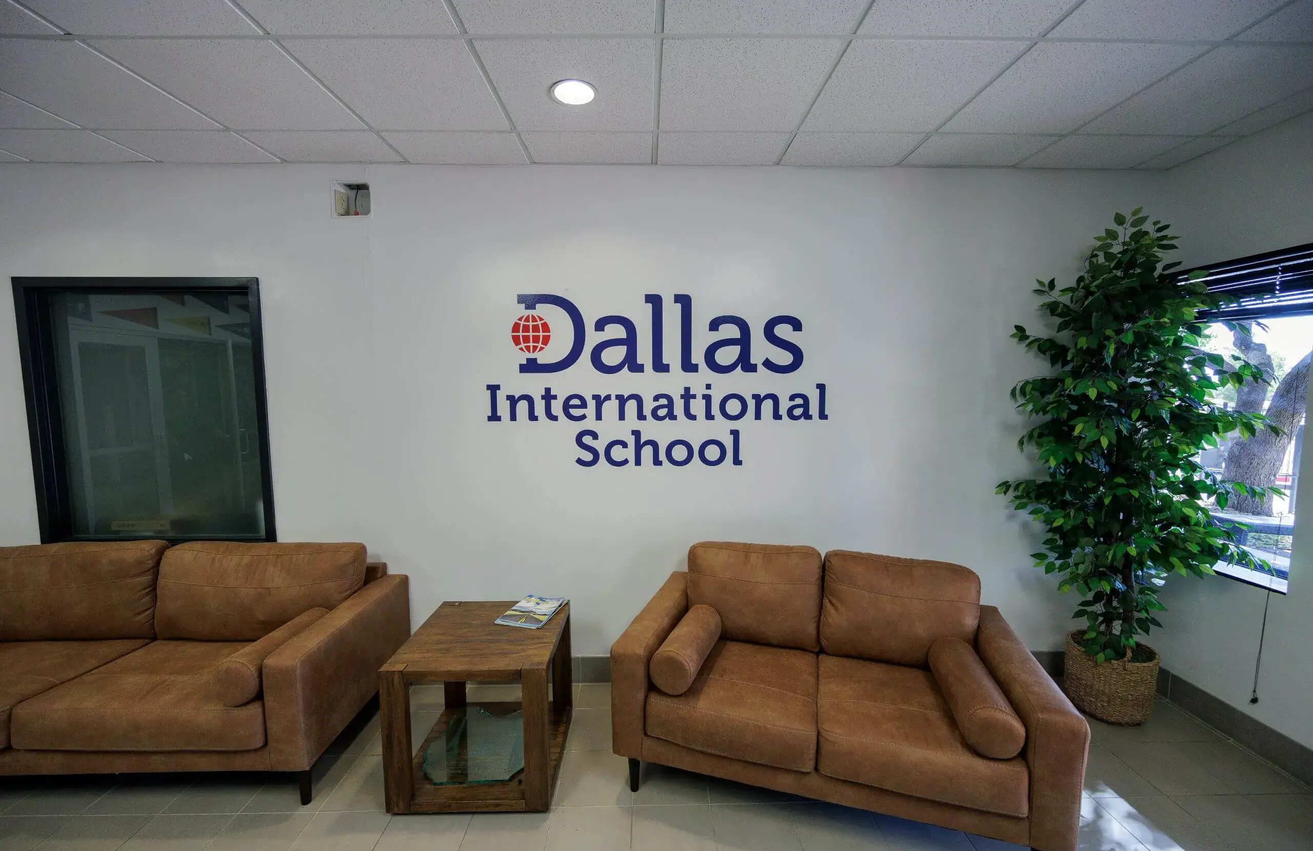 DIS Logo decorating wall on campus.