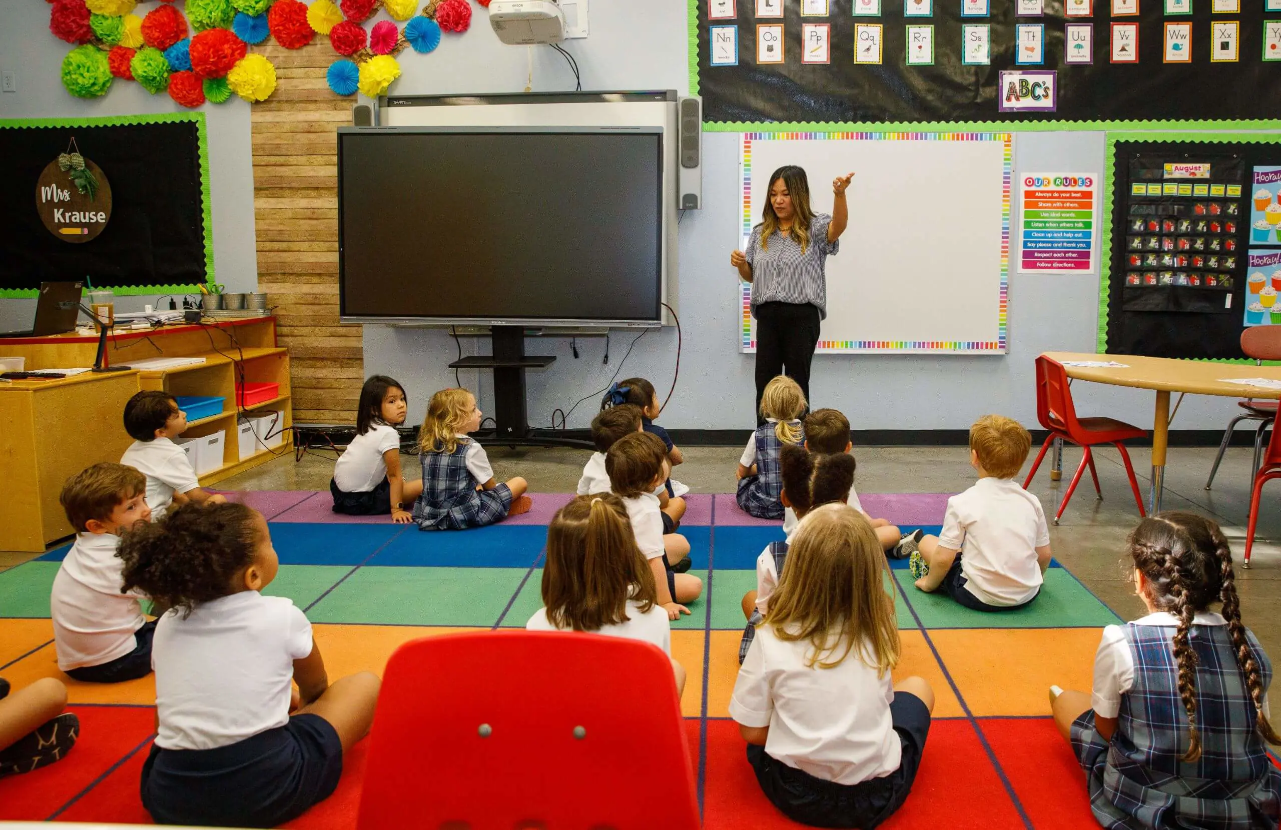 DIS elementary school teacher leading a lesson.