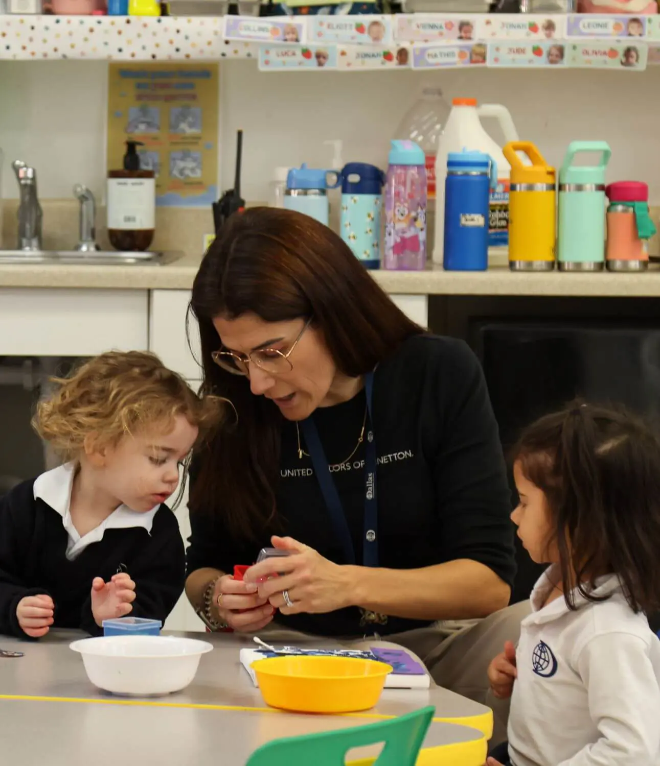 DIS Teacher working with early childhood students in a class.