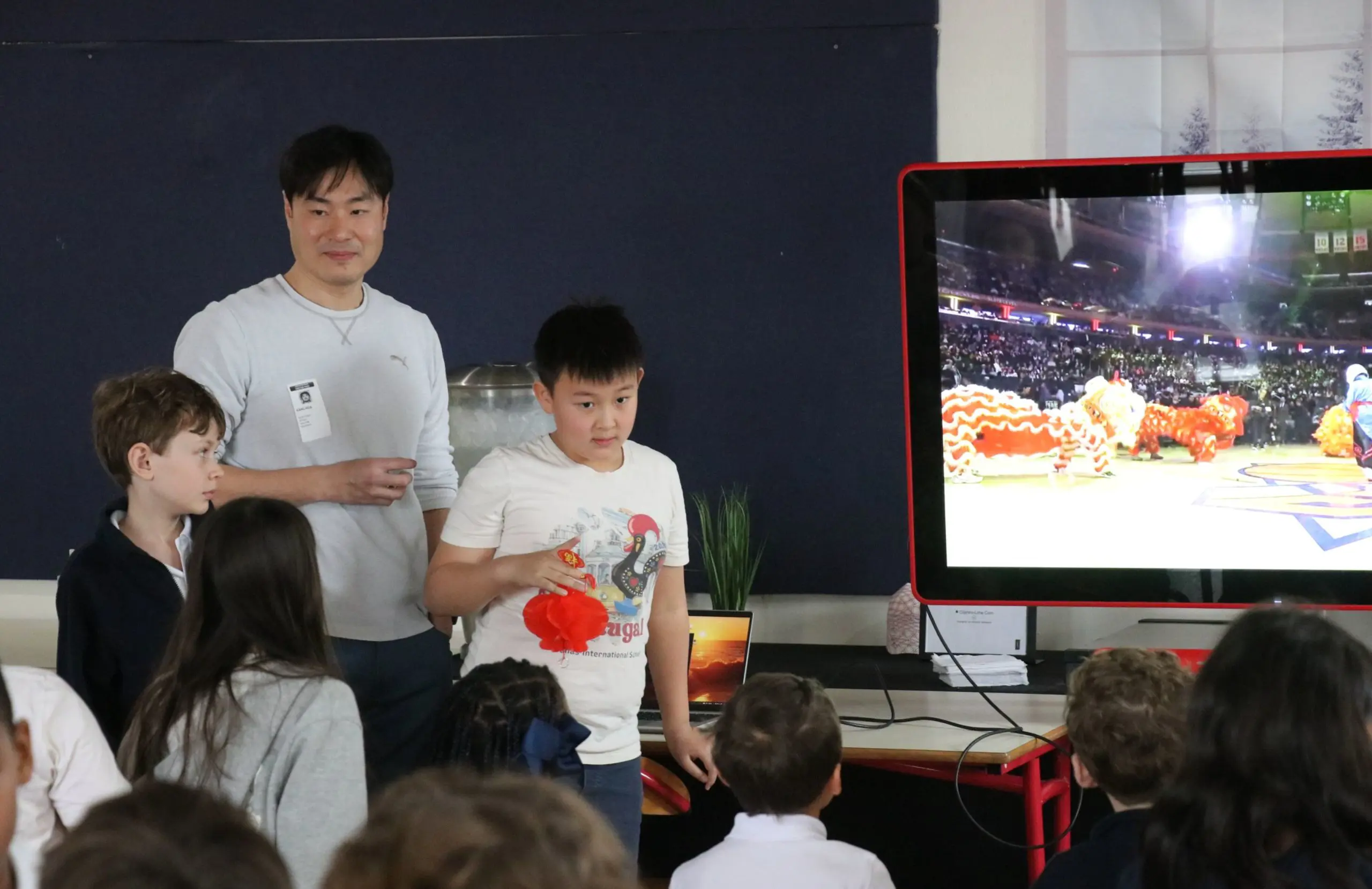 Parent and students giving a presentation at DIS.