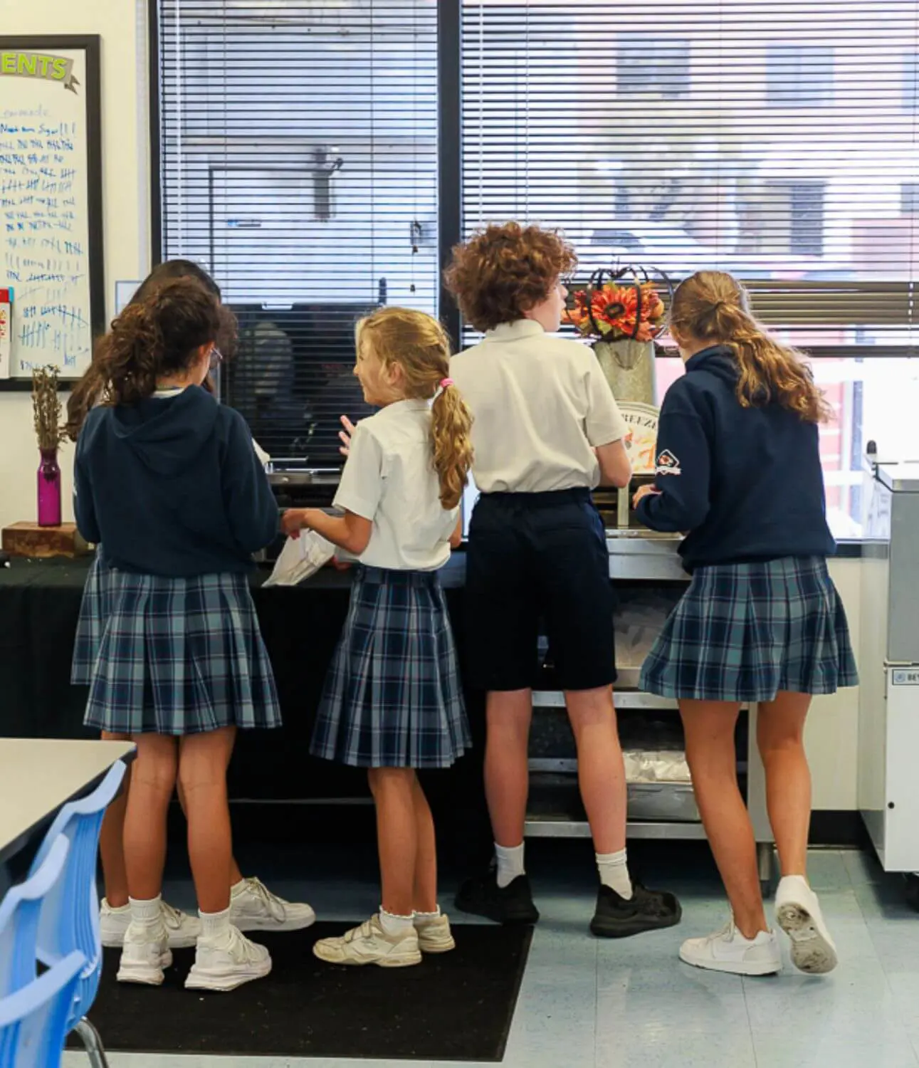 Students getting lunch in the cafeteria.