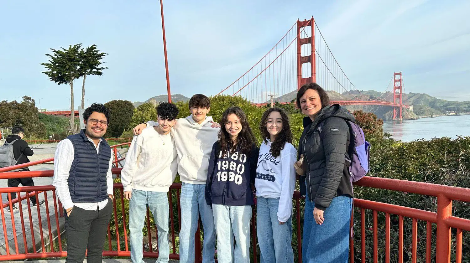 DIS students and teachers pose for a photo by the Golden Gate Bridge while attending the Start-Up Competition in San Francisco.